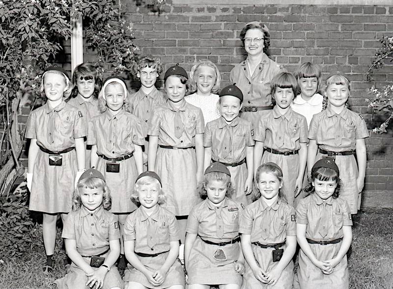 Brownie Troop 177 from Glidden School and leader Mrs. Raithel on May 12, 1964, are seen at a Court of Awards and a special tea for their mothers at St. Peter's.