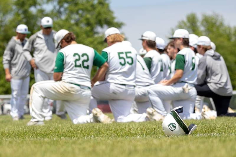 St. Bede batting helmet lays ahead of team during their post game meeting on Saturday, May 24, 2025 at Stark County High School in Toulon.