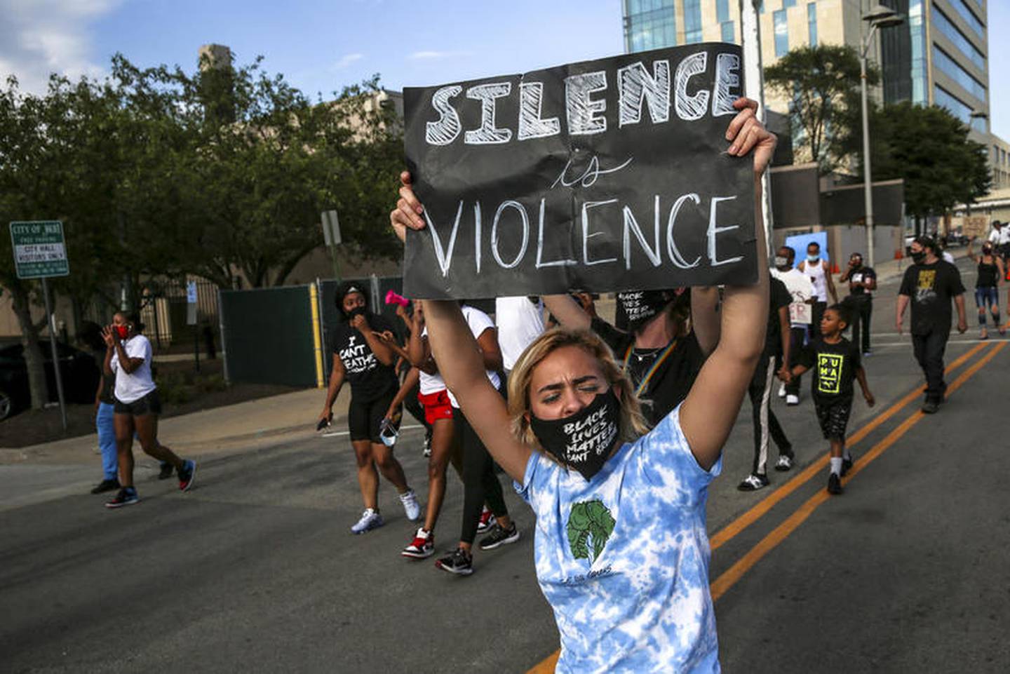 Demonstrators can be seen protesting outside Joliet City Hall, the Will County Courthouse and the Joliet Police Department on Saturday, Aug. 22, 2020, in response to the January 28 overdose death of Eric Lurry who died in police custody.