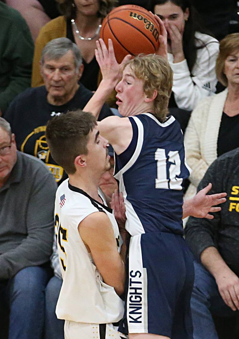 Fieldcrest's Jordan Heider collides with Putnam County's Wyatt Grimshaw while chasing down a loose ball on Tuesday, Feb. 7, 2023 at Putnam County High School.