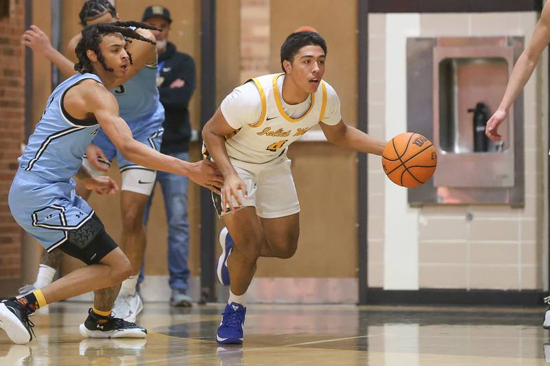Joliet West’s Brockton Goehrke takes the forced turnover up court against Kankakee on Wednesday, Feb. 18, 2026 in Joliet.