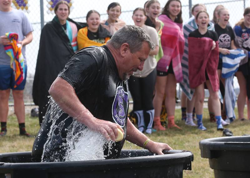 Serena High School superintendent Rich Faivre hops into a bucket of cold water during the Polar Plunge for Special Olympics on Friday, March 21, 2025 at Serena High School.