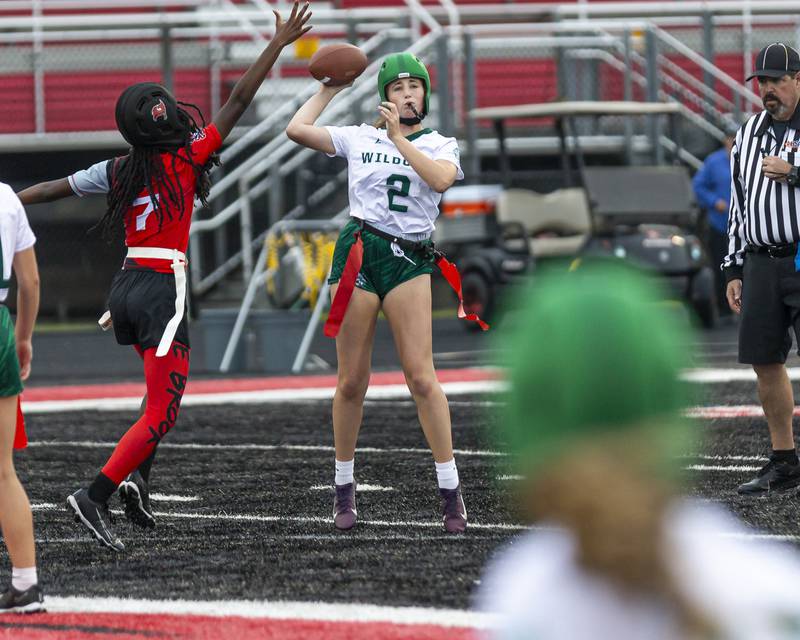 Plainfield Central's Alyssa Link (2) passes while being pressured during flag football game between Plainfield Central at Bolingbrook Wednesday, Sept 3, 2025  in Bolingbrook.