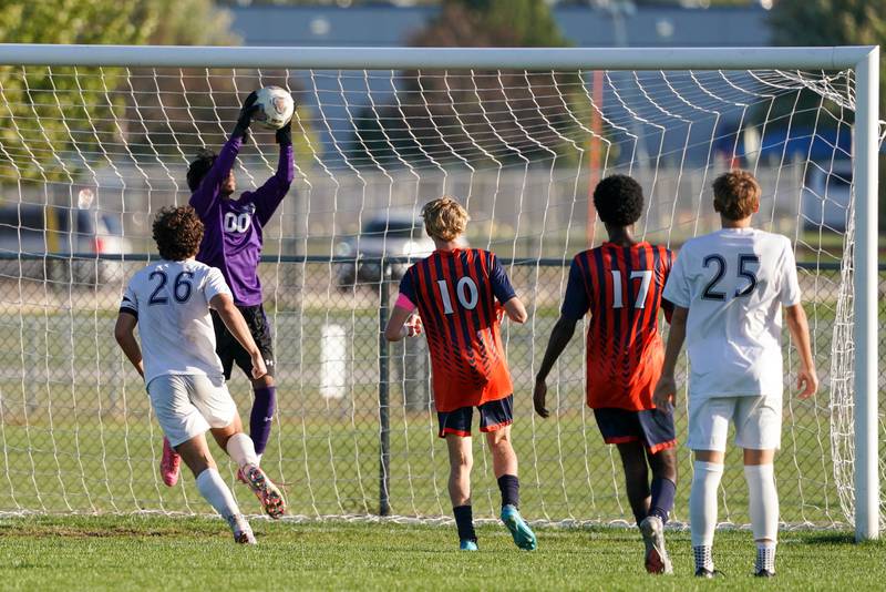 Oswego’s Brayden Beverwyk (0) makes a save against Oswego East during a soccer match at Oswego High School on Tuesday, Oct. 1, 2024.