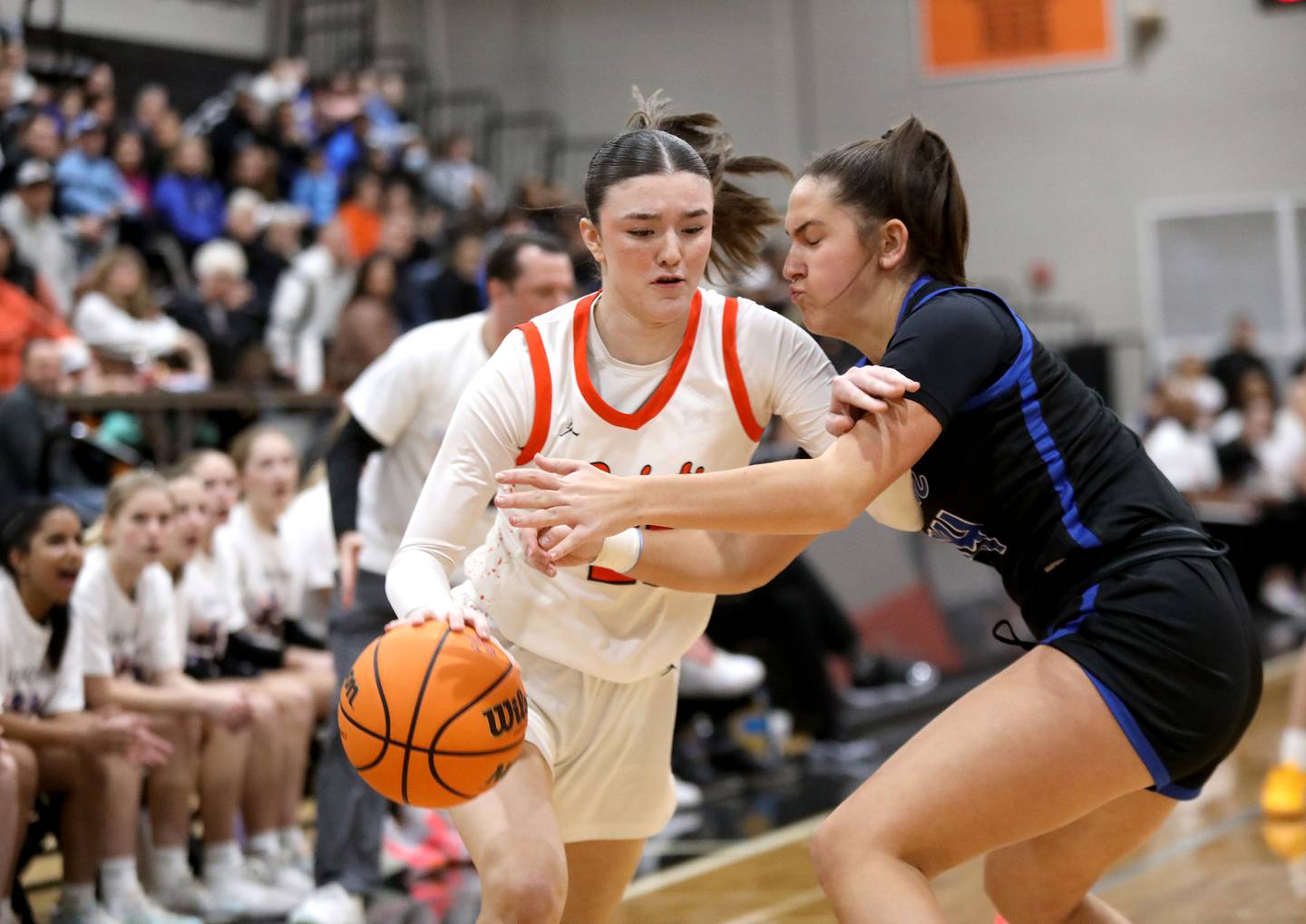 St. Charles East's Sofia O’sullivan tries to get around St. Charles North's Riley Barber during a game on Friday, Jan. 31, 2025 at St. Charles East.