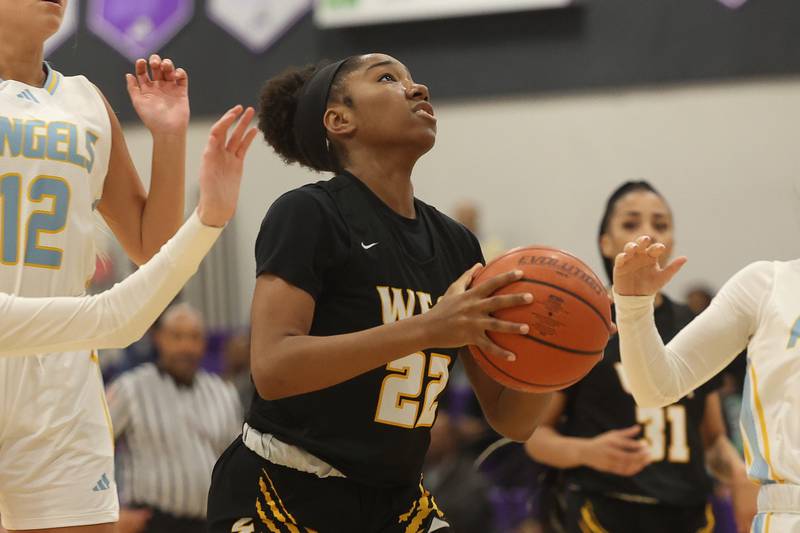 Joliet West’s Makayla Chism goes in for the shot against Joliet Catholic in the 2023 WJOL Girls Basketball Tournament on Friday, Nov. 17, 2023, in Joliet