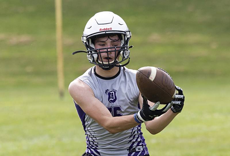 Dixon’s Jay Zeigler hauls in a catch during first day of football practice Monday, Aug. 12, 2024.