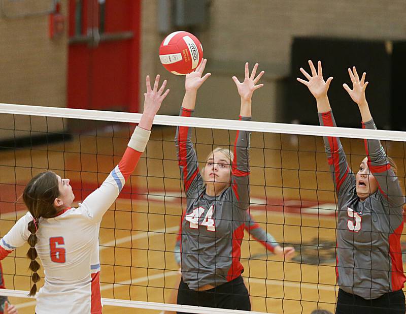 Ottawa's Mel Pries (6) has her spike blocked by L-P's Camryn Piscia (44) and teammate Emma Garretson (5) on Tuesday, Oct. 18, 2022 at Kingman Gymnasium in Ottawa.