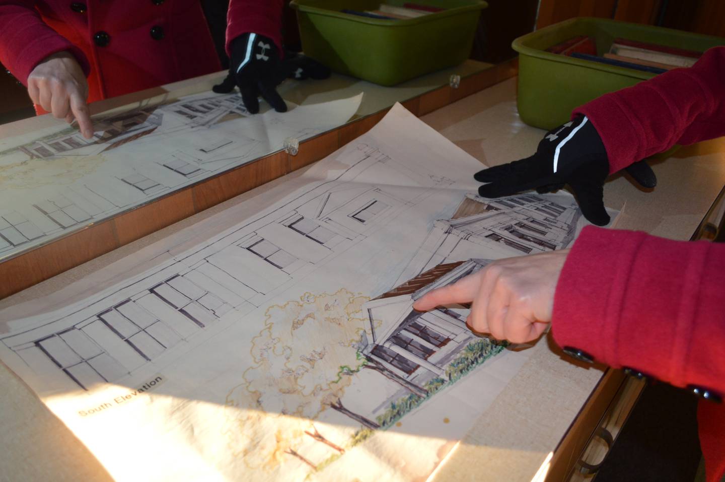 Cynthia Reynolds points to an original sketch of an addition to the Barber bank building in downtown Polo. At one point, the building held a bank, the city’s post office, a doctor’s office, attorney’s office, bridal shop and barber shop. Reynolds and her husband, James, recently purchased the historic building and plan to restore and preserve it.