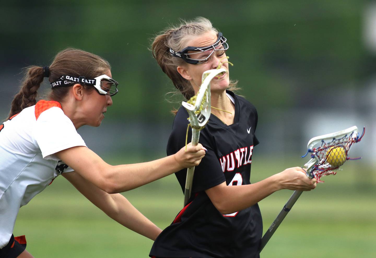 Crystal Lake Central United’s Sydney Cruz, left, battles Huntley’s Isabella Gregorio in IHSA Sectional Title Game action at Crystal Lake Central High School in Crystal Lake on Friday, May 30, 2025.