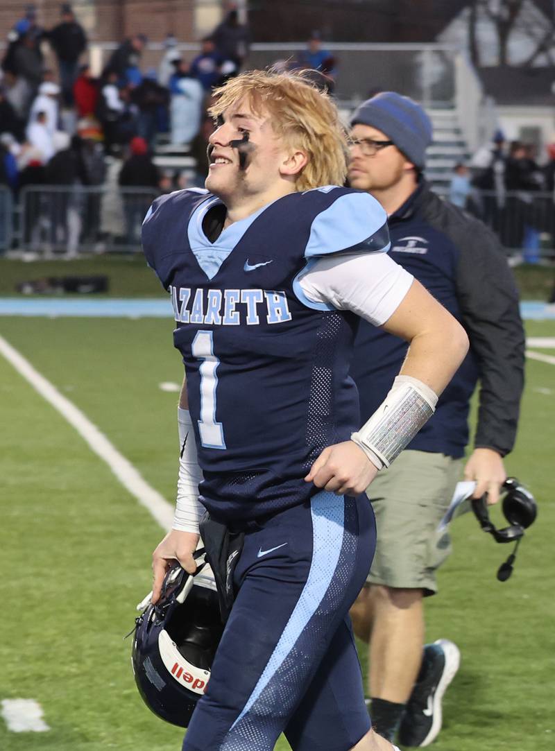 Nazareth's Logan Malchuk (1) is all smiles after winning against St. Francis at the boys varsity IHSA 5A semifinal between Nazareth Academy and St. Francis high school in La Grange Park, IL on Saturday, Nov. 18, 2023.