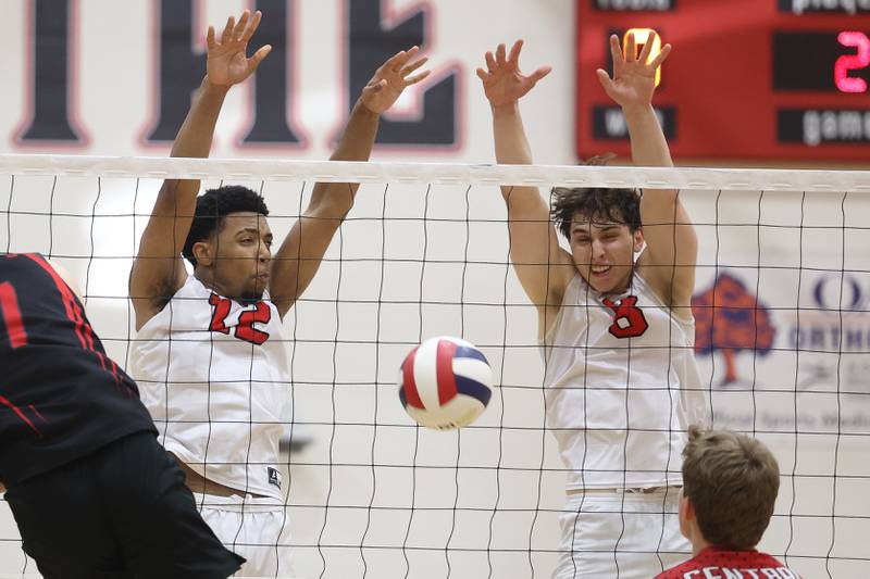 Bolingbrook’s Jacqson LeSure and Charlie Bialek watch as the block shot falls for a point against Lincoln-Way Central on Tuesday May 7, 2024 in New Lenox.