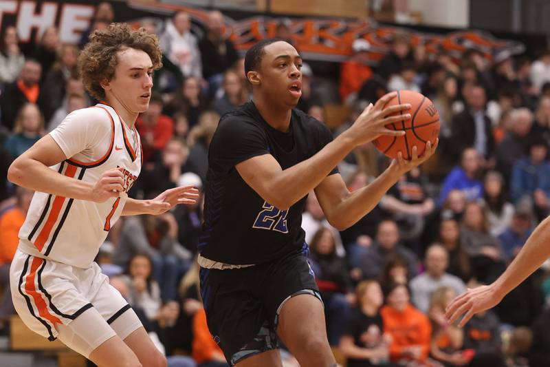 Lincoln-Way East’s Kyle Olagbegi looks for a play against Lincoln-Way West.