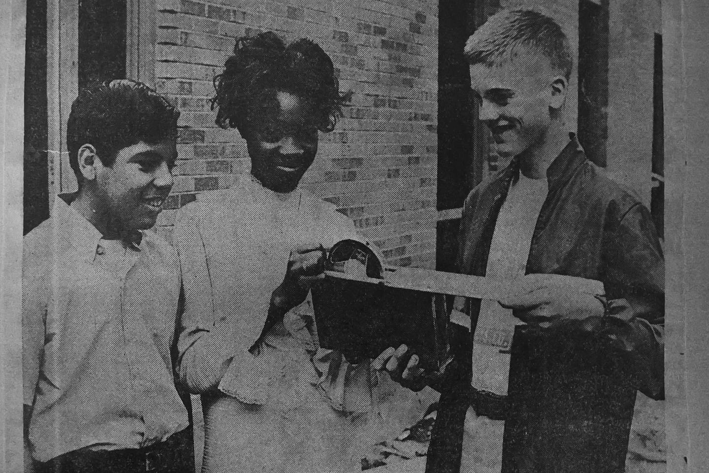 A photo from 1969 shows Grompers Junior High School students, including Larry Nielsen, left, placing items in a time capsule. In 1969 students placed items in a time capsule and sealed it inside a wall when an extension was built at Grompers Junior High School.