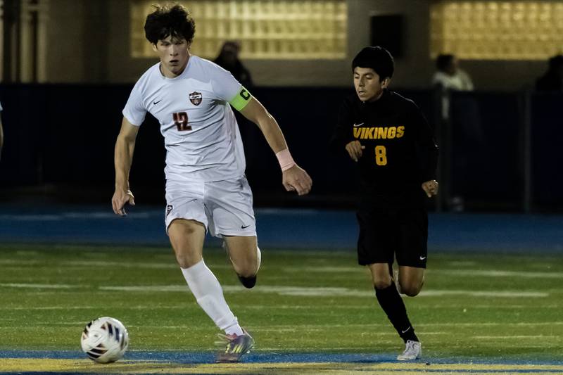 Lincoln-Way Central's Aidan Byrne and St. Laurence's Cesar Rivera go head to head during a Class 3A Boys Soccer Super-Sectional game at Lyons Township High School’s South Campus on Nov. 3, 2025.