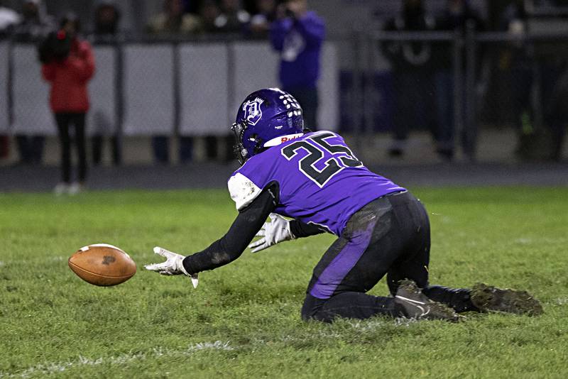 Dixon’s Landon Knigge drops a punt late in the first half in a first round playoff game against Plano Friday, Oct. 27, 2023 in Dixon.