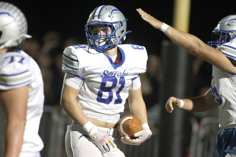 Woodstock’s Keaton Perkins is greeted in the end zone on a touchdown in varsity football at Woodstock North Friday night.