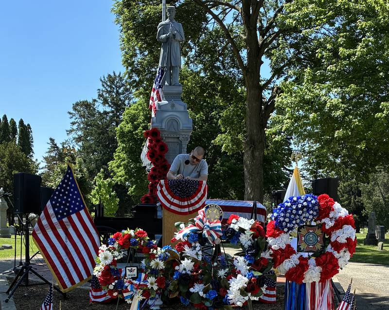 A Crystal Lake employee gets the sound system ready for the Memorial Day Service at Union Cemetery on Monday, May 25, 2026.