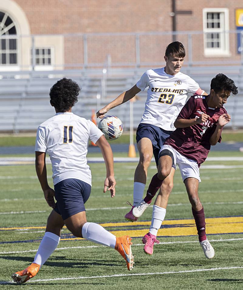Sterling’s Carter Chance and Dunlap’s Yoshant Adhikari go for the ball Saturday, Oct. 21, 2023 in the regional finals game in Sterling.