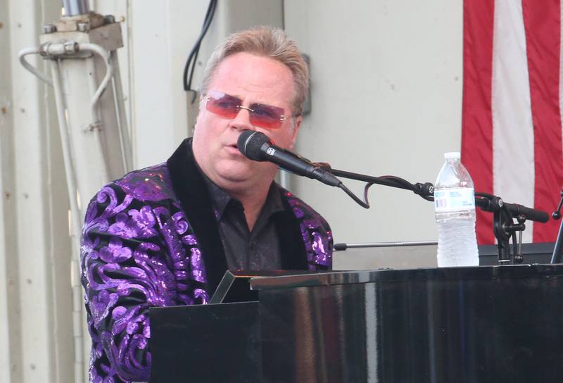 Ronnie Smith as Elton John of the Face 2 Face tribute band, sings during the Down on Main Street Summer Concert series on Friday, Aug.  8, 2025 in Princeton.