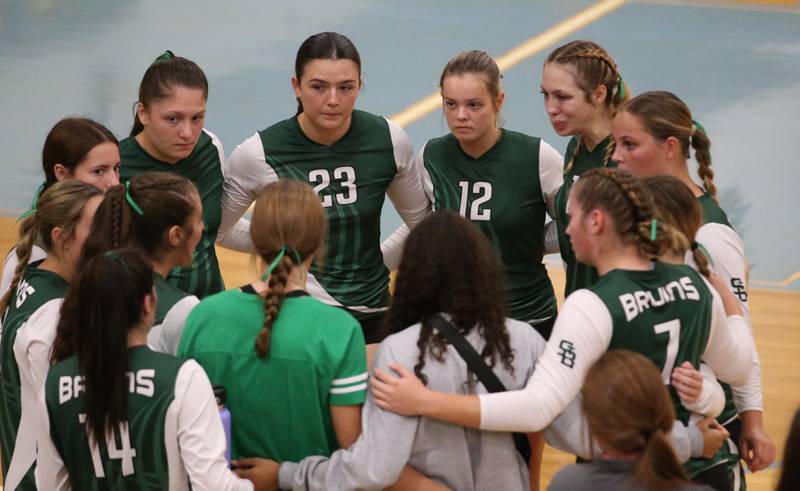 Members of the St. Bede volleyball team huddle between sets while playing Bureau Valley on Tuesday, Sept. 5, 2023 at Bureau Valley High School.