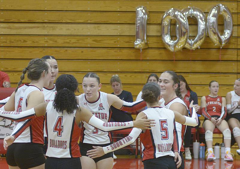 The Lady Bulldogs celebrate as they tie the score late in the 1st set against Wilmington Thursday at Streator.
