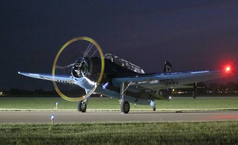 A TBM glows in the night during the TBM Avenger Reunion on Friday, May 19, 2023 at the Illinois Valley Regional Airport in Peru.