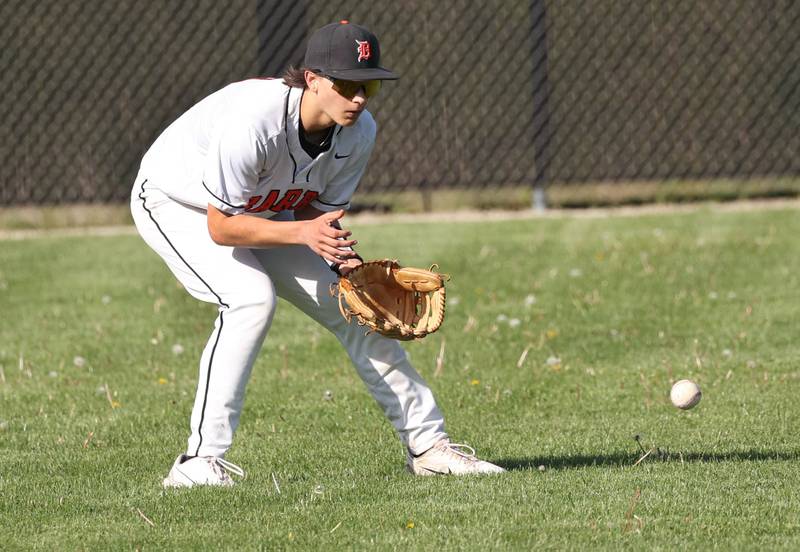 DeKalb's Ruari Bengford-Breneisen fields a ball in left field during their game against Neuqua Valley Tuesday, May 7, 2024, at DeKalb High School.