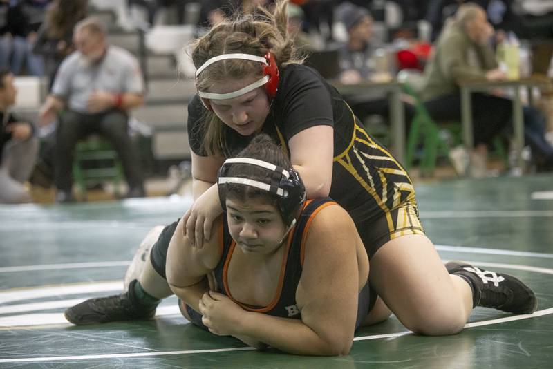 Ella Irwin of Putnam County High School wrestles Aariana Bloyd of Dekalb High School during the IHSA girls wrestling sectionals at Geneseo High School on February 10, 2024.