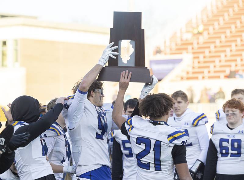 Maroa-Forsyth hoists the second place trophy after falling to Wilmington 42-6 Friday, Nov. 28, 2025, in the Class 2A football finals at Hancock Stadium at ISU.
