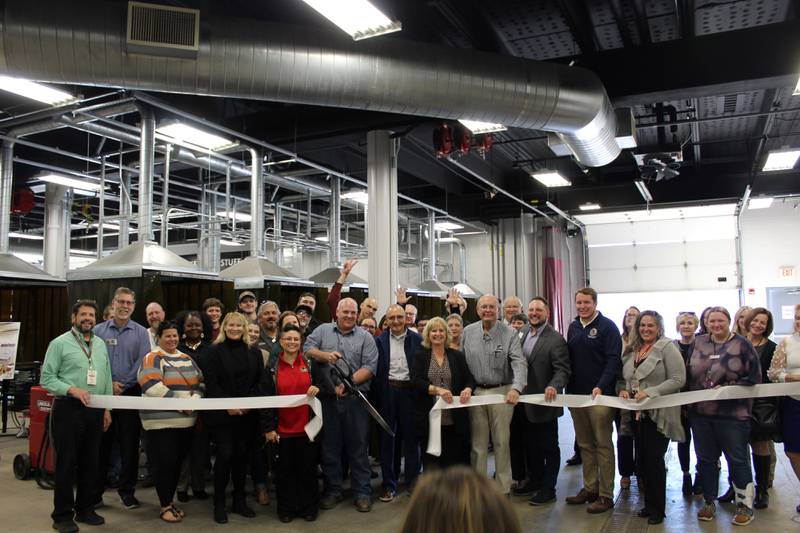 The DeKalb Chamber of Commerce celebrating Kishwaukee College's new welding lab with a ribbon-cutting