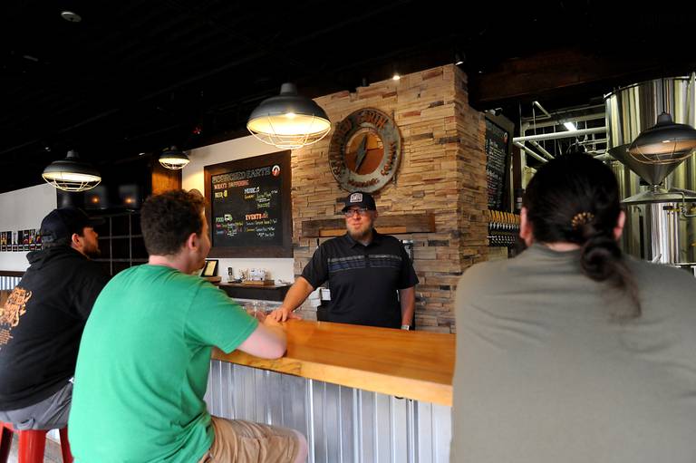 Greg Doyen, the new owner of Scorched Earth Brewing, talks with employees Tuesday, May 10, 2022, at the brewery at 203 Berg St. in Algonquin.