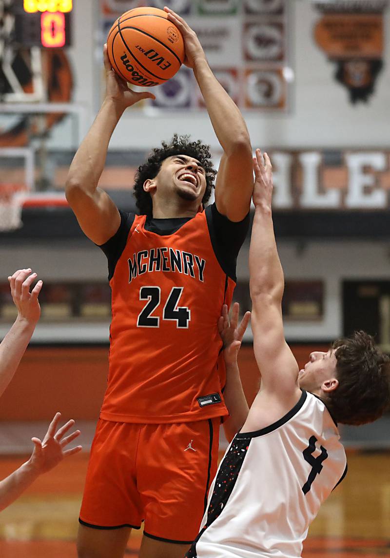 McHenry's Adam Anwar shoots the ball over Crystal Lake Central's Bud Shanahan during a Fox Valley Conference boys basketball game on Tuesday, February. 10, 2026, at Crystal Lake Central High School.