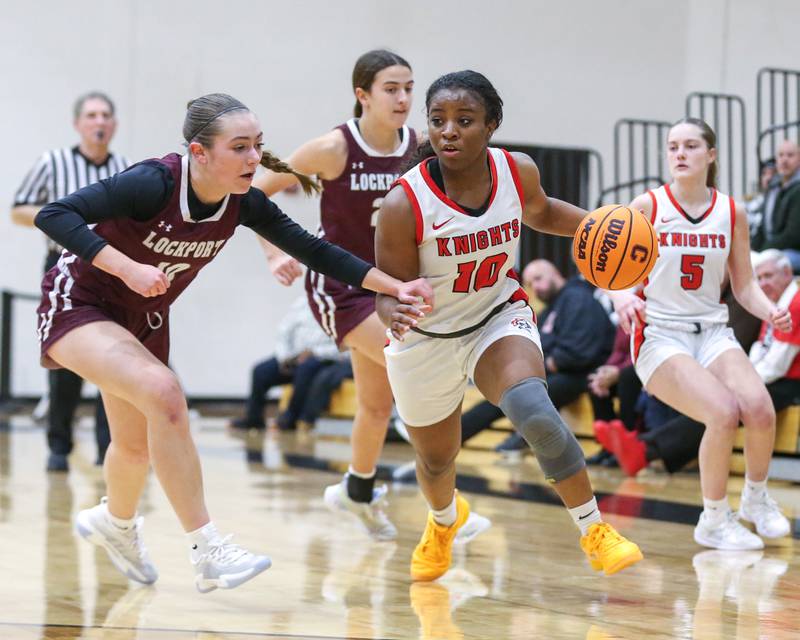 Lincoln-Way Central's Kiya Newson-cole (10) drives past the defense during their basketball game between Lockport at Lincoln-Way Central. Jan 21, 2025 in New Lenox.