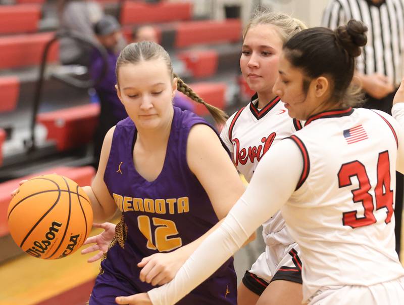 Mendota's Karissa Freeman is double teamed by Hall's Charlie Pellegrini and teammate Natalia Zamora on Monday, Dec. 1, 2025 at Hall High School.