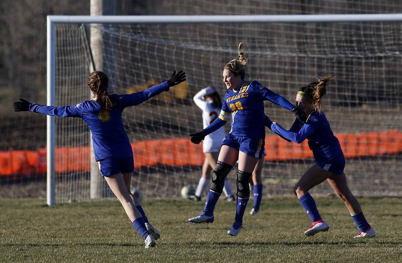 Johnsburg’s Mackenzie McQuiston (center) celebrates a goal with her teammates Wynne Offling (left) and Lauren McQuiston during a Kishwaukee River Conference soccer game on against Richmond-Burton on Wednesday, March 20, 2024, at Johnsburg High School.