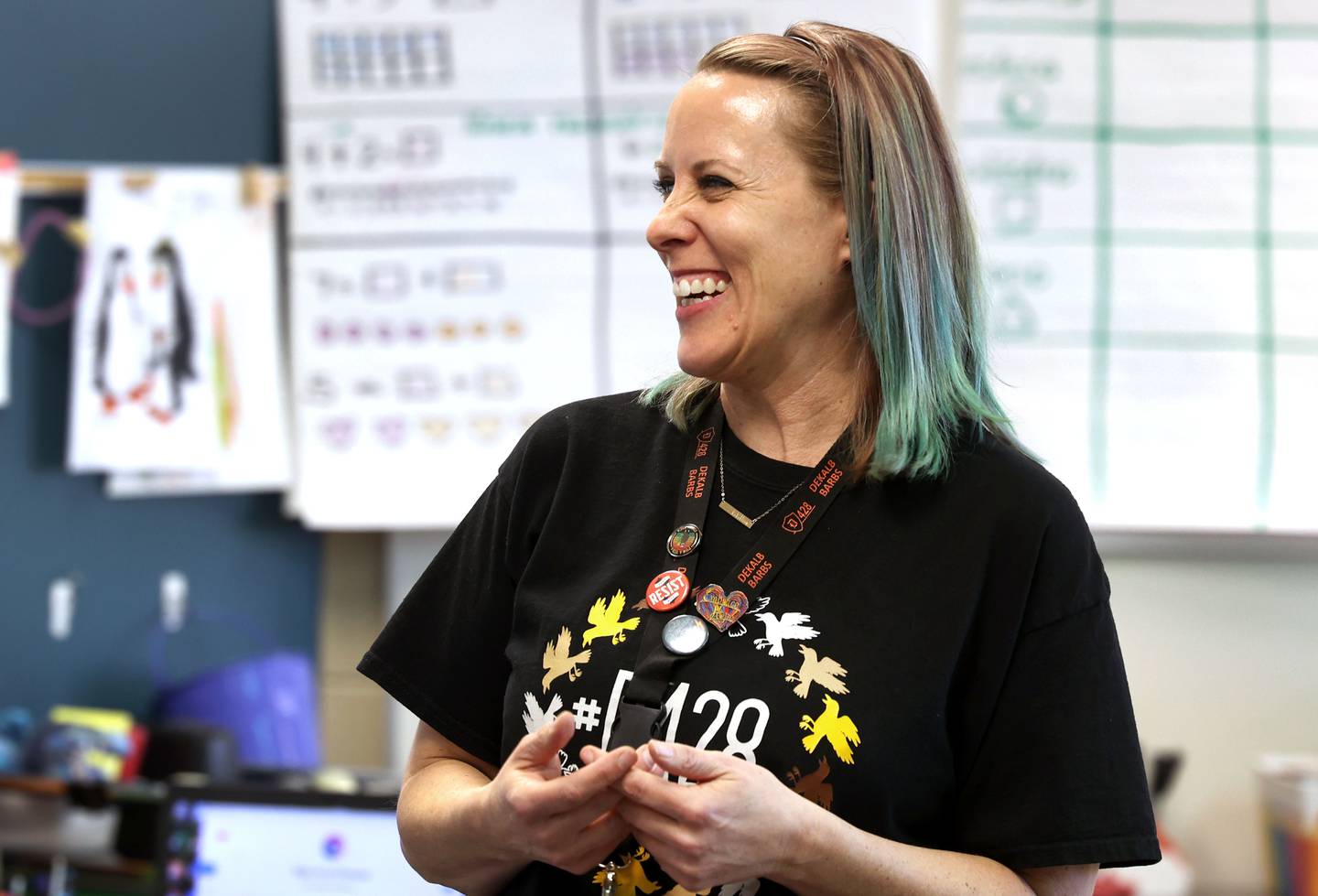 AJ Crook, Multilingual Programs Coordinator for School District 428, smiles as she talks to parents Tuesday, March 11, 2025, at Cortland Elementary School, about the districts two-way dual language program during an informational open house on the subject.