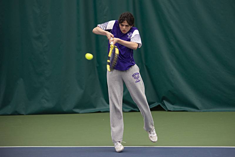 Dixon's Alex Ulrich plays a shot against the Sterling doubles team of Carter Harris and Hunter Lofgren Thursday, May 5, 2022.