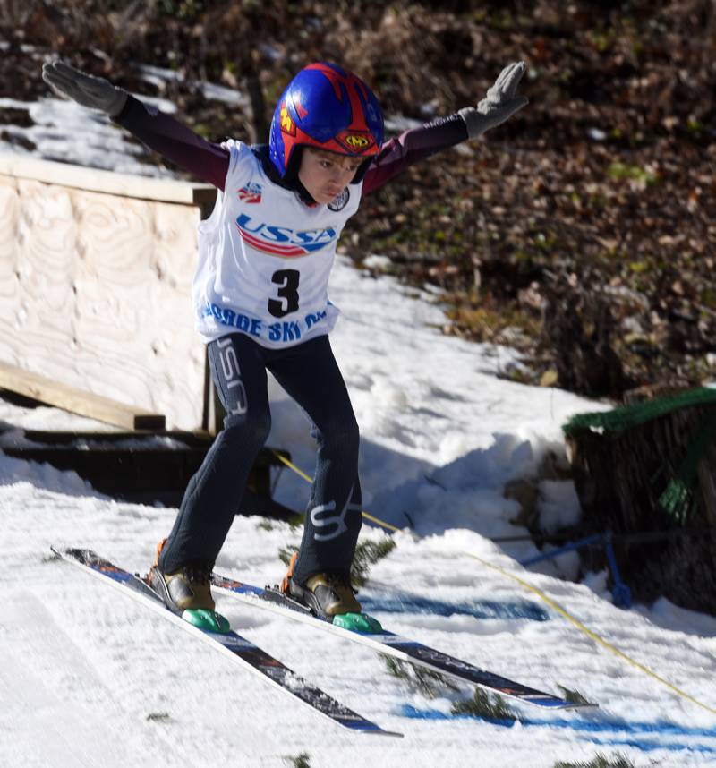 Daniel Ilkiv of Norge makes his jump in the U6 male category during opening day of the Norge Ski Club’s 118th annual Winter Ski Jump Tournament Saturday.