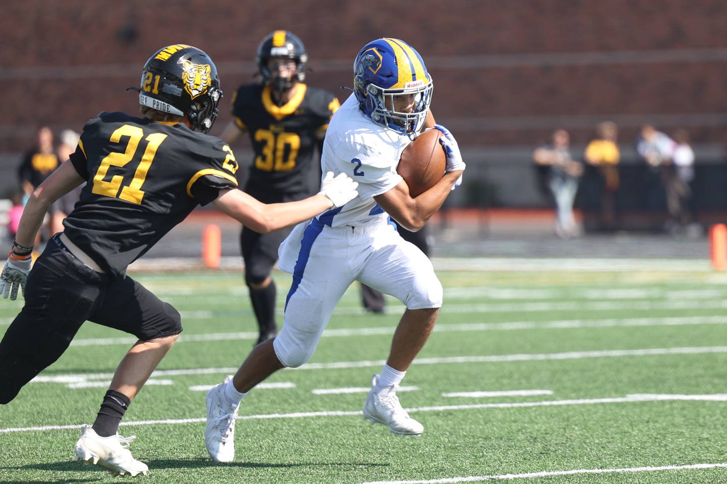 Joliet Central’s Christian Smith heads upfield after a catch against Joliet West on Saturday, Sept. 23, 2023 in Joliet.