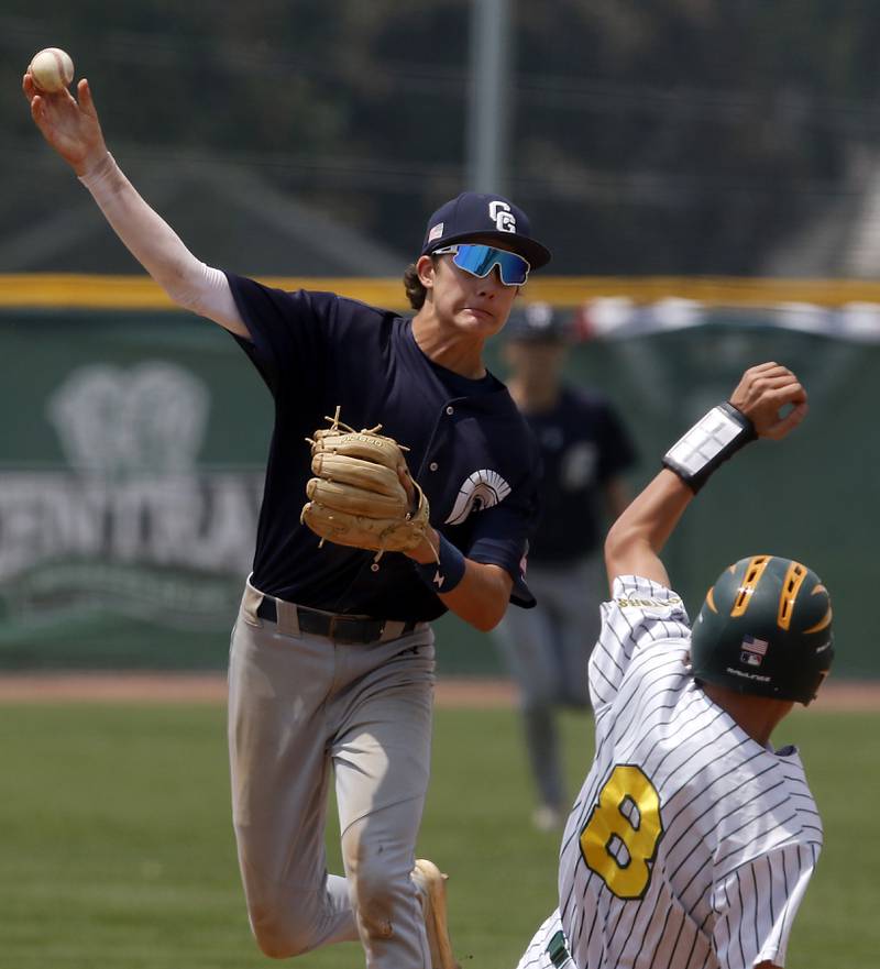 Cary-Grove's Ricky Barnes throw to first as he turns a double play as Crystal Lake South's Michael Rathjen slides into second bas during the IHSA Class 3A Grayslake Central Sectional Championship baseball game  on Saturday, June 7, 2025, at Grayslake Central High School.