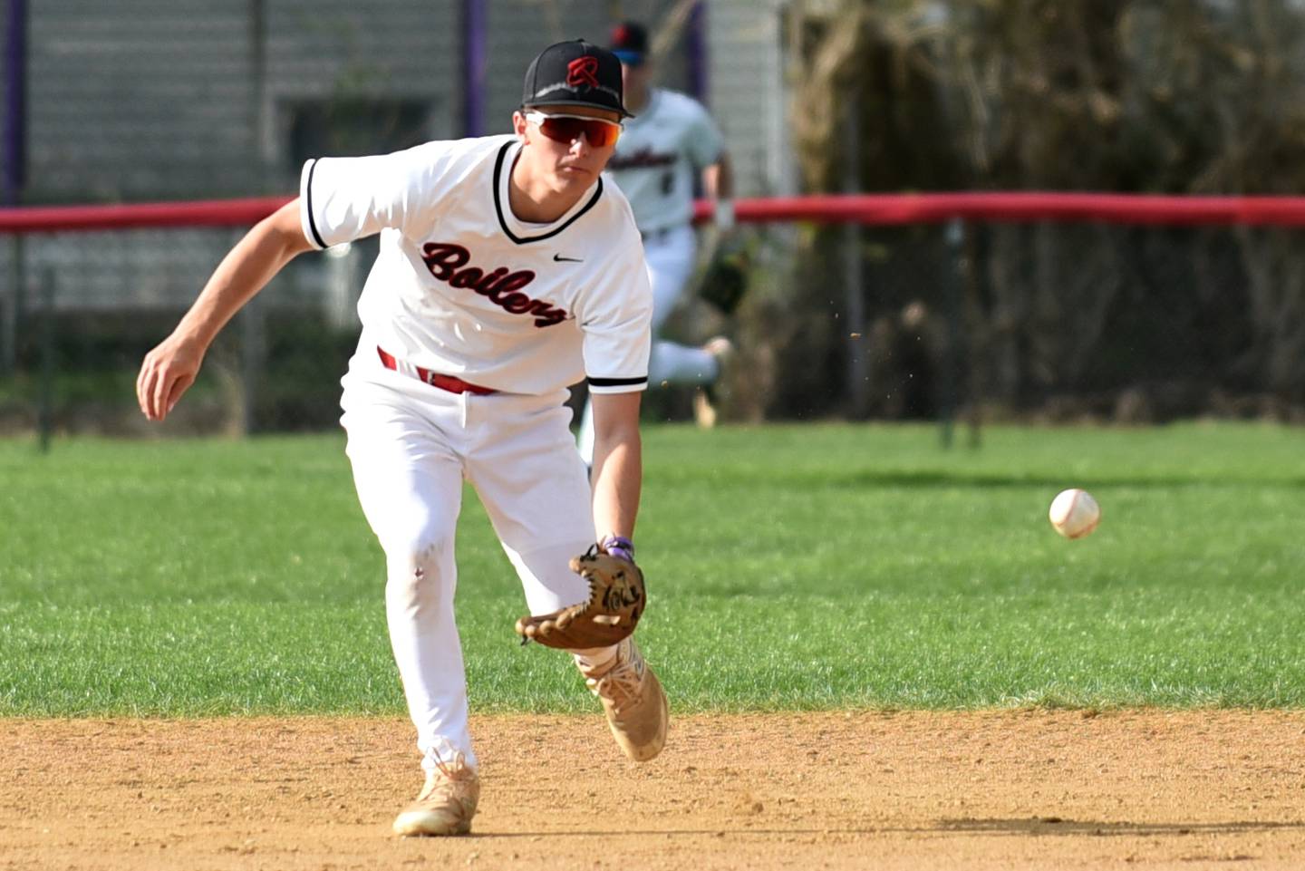 Bradley-Bourbonnais' Jace Boudreau fields a ground ball during a home game against Lincoln-Way West Thursday, May 1, 2025.