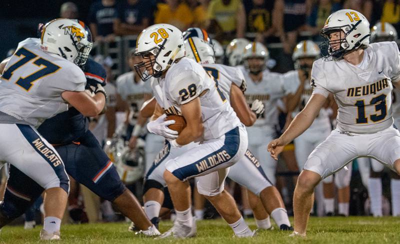 Neuqua Valley's Silvano Spatafora (28) carries the ball against Oswego during a football game at Oswego High School on Friday, Aug 26, 2022.