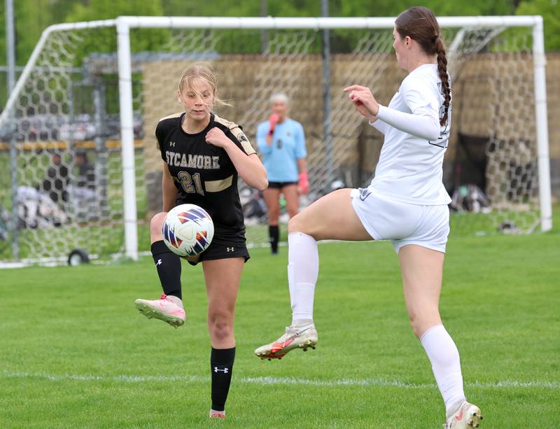 Sycamore's Kelsie Ryder and Kaneland's Erin Doucette try to gain possession during their game Wednesday, April 29, 2026, at Sycamore High School.