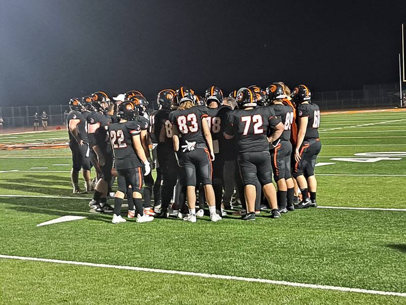 The Lincoln-Way West football team huddles during a timeout during its 41-7 win over Plainfield Central on Friday, Aug. 25, 2023 in New Lenox.