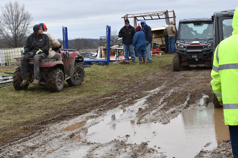 Some attendees at the Spring Hazelhurst Consignment Sale used all-terrain vehicles to navigate through the mud on Saturday, April 4, 2026. The annual auction is held on a farm field between Polo and Milledgeville.