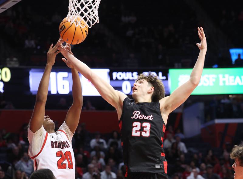 Benet’s Edvardas Stasys grabs a rebound over Marist's Kendall Meyers Saturday, March 14, 2026, during their IHSA Class 4A state championship game in the State Farm Center at the University of Illinois in Champaign.
