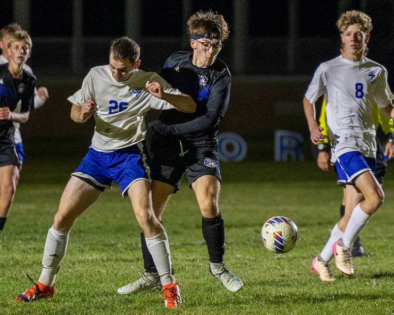 Austin Kennedy (26) of Hinckley-Big Rock is pushed away by Nolan Kerley (24) of Somonauk/Leland/Newark in the fight over possession during the Little Ten Conference Championship match on Thursday, Oct. 9, 2025 at Hinckley-Big Rock School in Hinckley.