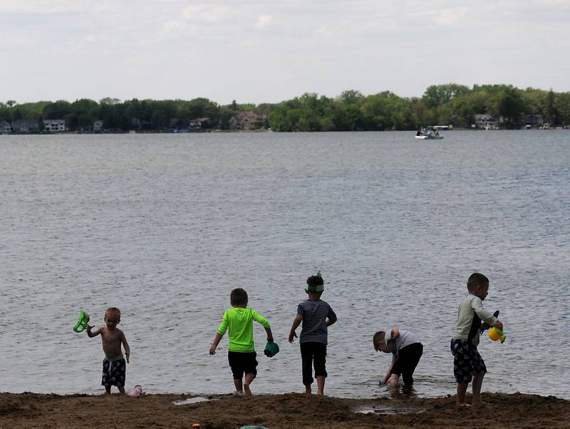 Children from a birthday party play on the beach Monday, May 23, 2022, at Crystal Lake's Main Beach, 300 Lakeshore Drive, in Crystal Lake.