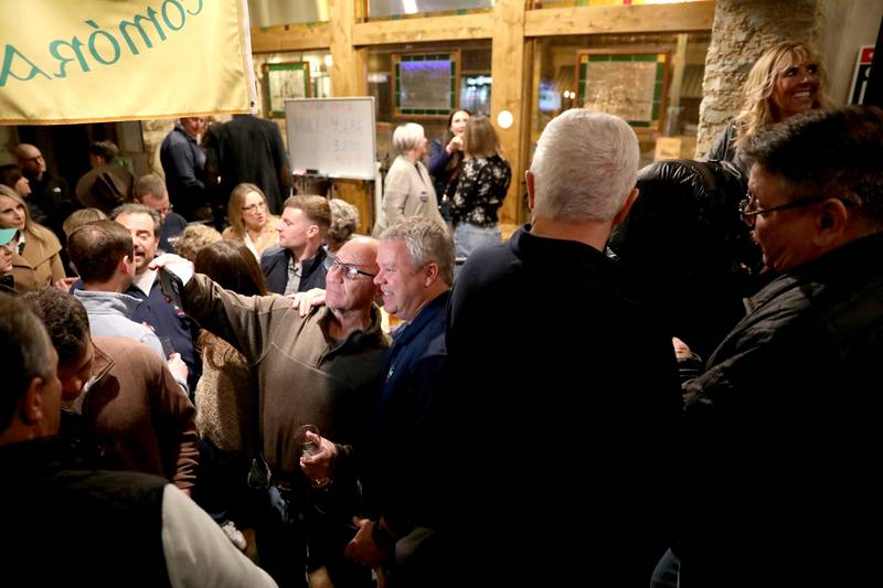 Clint Hull (right), candidate for St. Charles Mayor, visits with supporters while awaiting election results at McNally’s Irish Pub on Tuesday, April 1, 2025 in St. Charles.